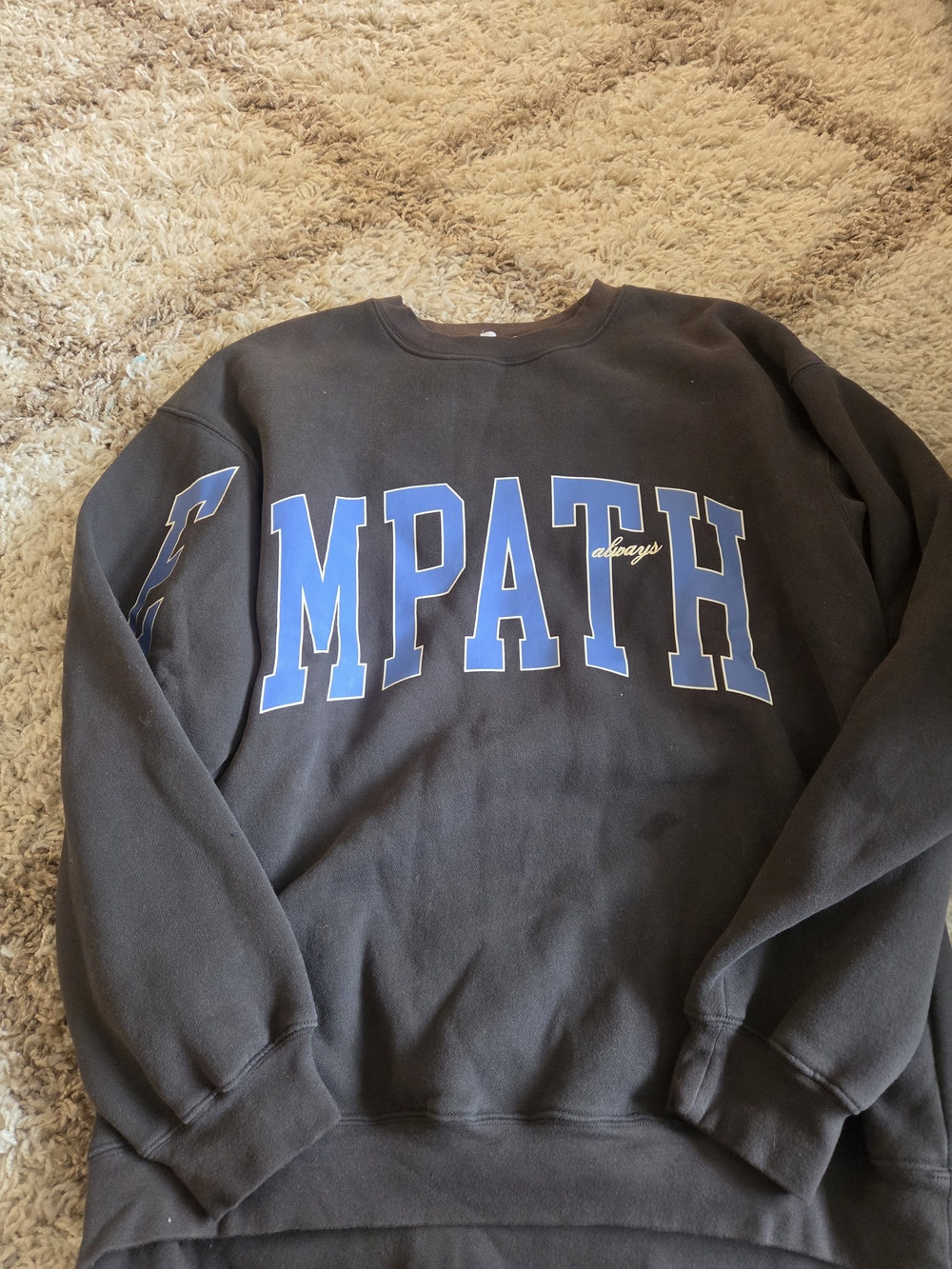 Black 'EMPATHY' crewneck Sweatshirt with Blue Lettering. has some wear. see pics